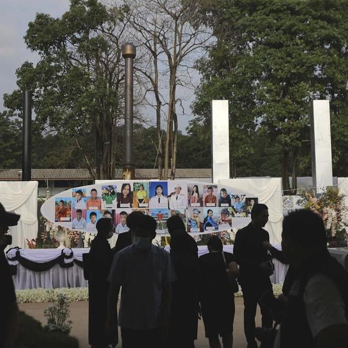Small town in Thailand hold mass cremation for 23 who died in a school trip bus fire